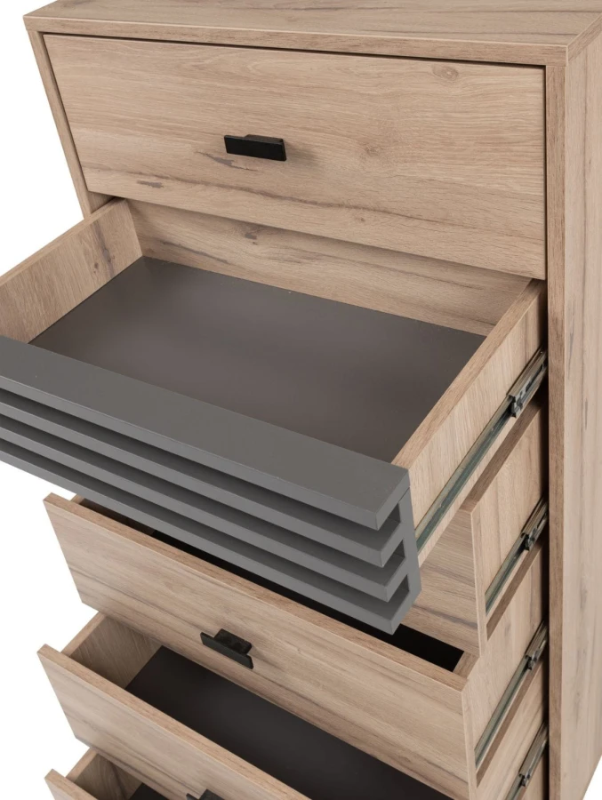 Close-up of the open drawers of a chest of drawers with high-quality metal runners.