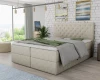 Beige boxspring bed with elegant button tufting and crystals in the bedroom