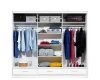 Interior of a wardrobe with clothes rails, shelves and neatly arranged laundry.
