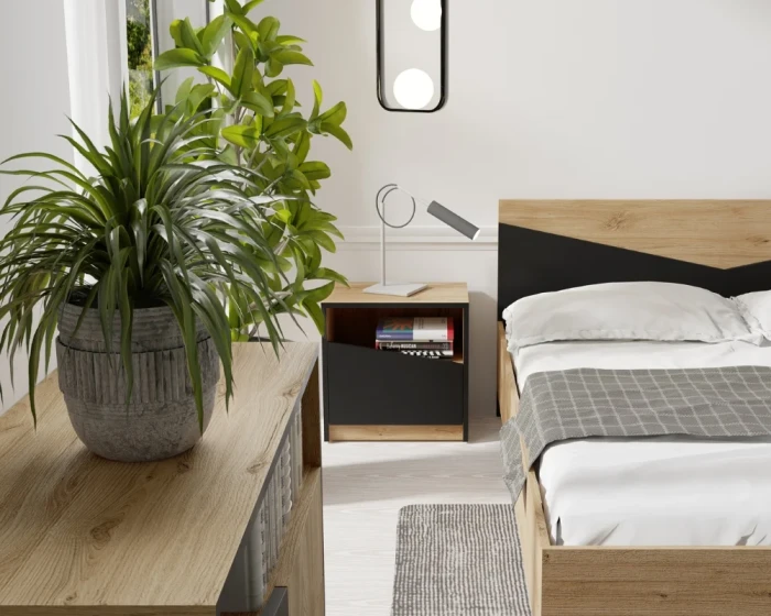 Stilvolle Schlafzimmereinrichtung mit Nachttisch und Bett in Schwarz und Eiche-Nachbildung.