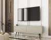 Beiges TV-Lowboard mit Rillenoptik, schwarzen Beinen und goldenen Details in stilvoller Optik.