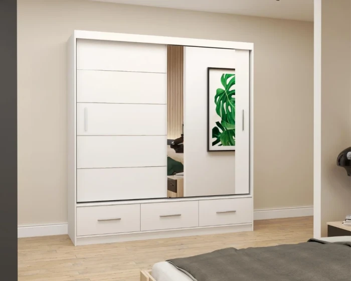 Weißer Schwebetürenschrank mit Spiegel und drei Schubladen im hellen Schlafzimmer.