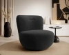 Dunkelgrauer Bouclé-Drehsessel in einem eleganten, modernen Interieur mit schwarzen Akzenten.