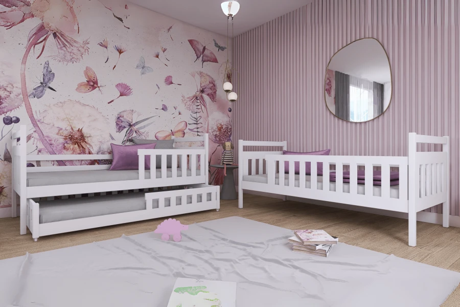 Set aus zwei weißen Kinderbetten, inkl. Ausziehbett, in einem modern gestalteten Mädchenzimmer.