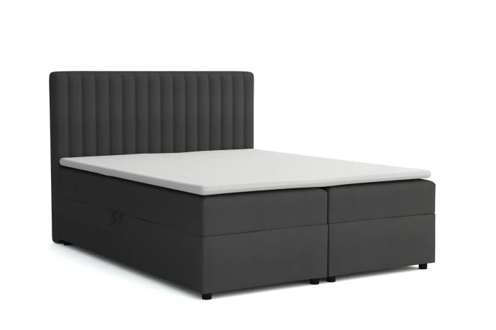 Anthrazitfarbenes Boxspringbett mit gestepptem Kopfteil, isoliert auf Weiß.