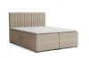 Cremefarbenes Boxspringbett mit modernem Design, freigestellt auf weiß.