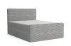 Graues Boxspringbett mit Kord-Bezug und gepolstertem Kopfteil für modernes Schlafzimmerdesign.