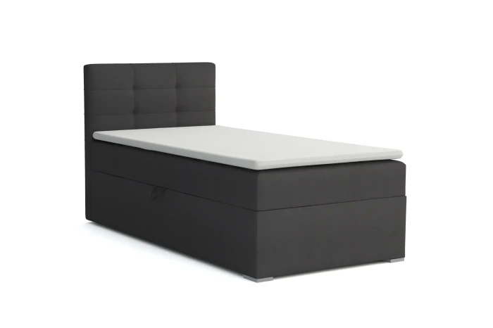 Dunkelgraues Boxspringbett mit quadratisch gestepptem Kopfteil und Topper.