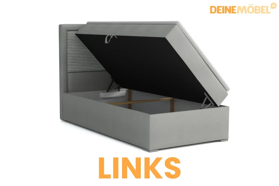 Hellgraues Boxspringbett mit seitlicher Öffnung links und großem Bettkasten für Stauraum.