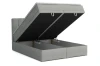 Graues Boxspringbett mit aufgeklappten Bettkästen für praktischen Stauraum unter der Matratze.
