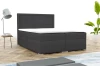 Anthrazitfarbenes Boxspringbett mit gestepptem Kopfteil in stilvollem Schlafzimmer-Ambiente.
