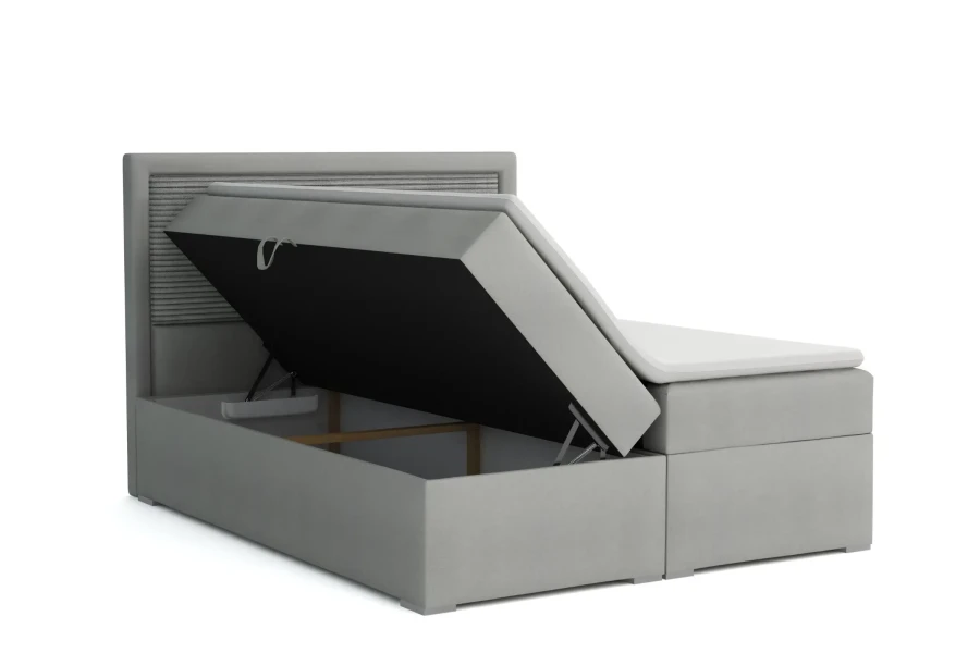 Detailansicht des aufklappbaren Bettkastens bei einem grauen Boxspringbett.