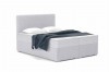 Hellgraues Boxspringbett in Bouclé-Optik mit gemütlicher blauer Decke und weißen Kopfkissen.