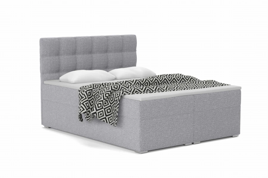Komfortables Boxspringbett in Grau mit gestepptem Kopfteil und geometrischer Decke