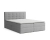 Graues Boxspringbett mit gestepptem Kopfteil und Stauraum, Ansicht von vorne links.
