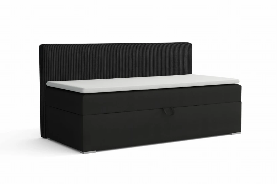 Modernes schwarzes Boxspringbett mit Cord-Kopfteil und weißem Topper.