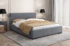 Anthracite upholstered bed in a stylish bedroom atmosphere with noble decoration.