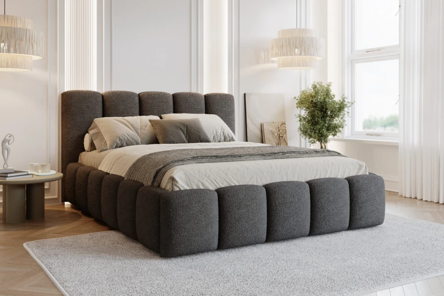 Dunkelgraues Polsterbett in modern eingerichtetem Schlafzimmer.
