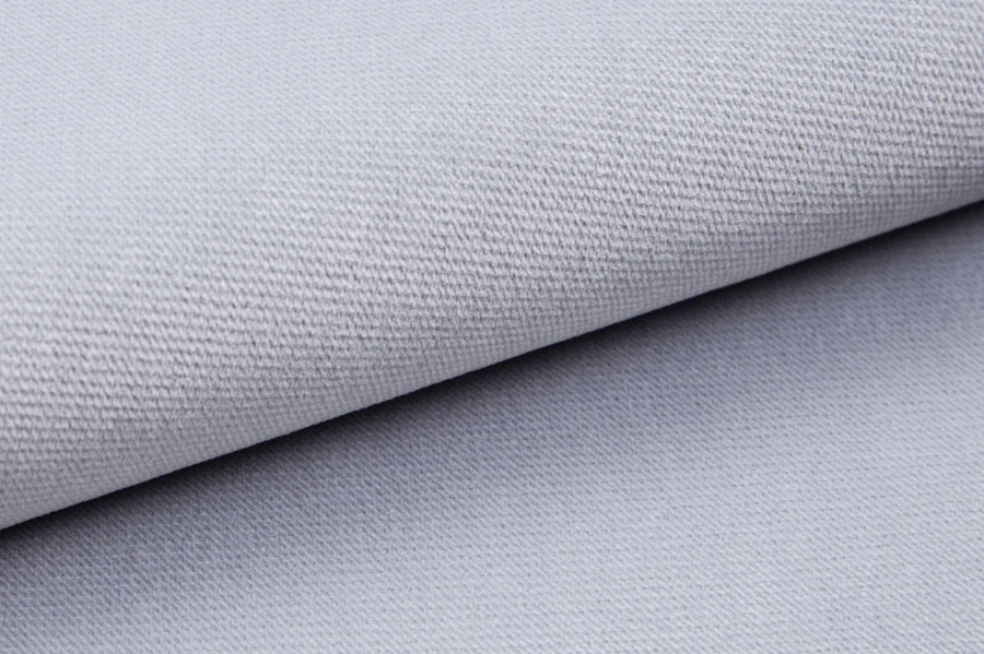 Light grey upholstery fabric with fine weave structure in close-up.