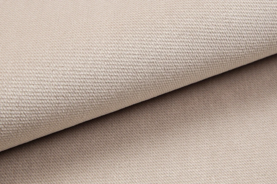 Beige upholstery fabric with high-quality weave structure close-up.