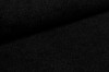 Detailed view of black textured fabric for upholstered furniture.
