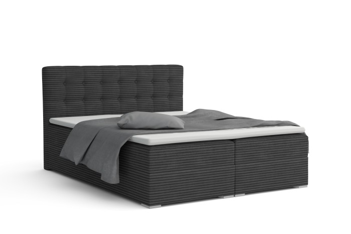 Dunkelgraues Boxspringbett mit Cordstoff-Struktur und hohem, gestepptem Kopfteil.