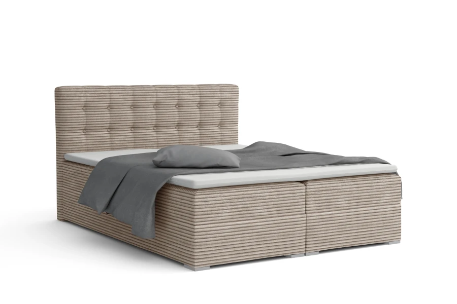 Lichtbruin boxspringbed met corduroy structuur en stijlvol hoofdbord op een witte achtergrond.