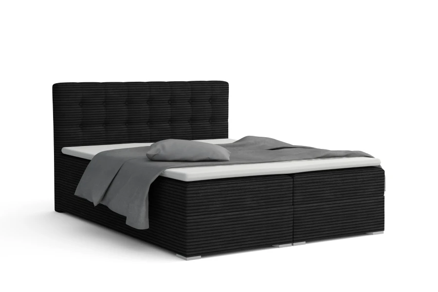 Modernes Boxspringbett in Anthrazit mit Cord-Bezug und gestepptem Kopfteil.