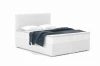 Modernes weißes Bouclé Boxspringbett mit blauer Decke und zwei Kopfkissen.