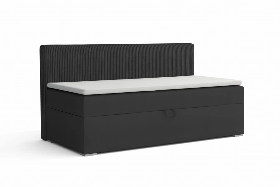 Modernes Boxspringbett in Dunkelgrau mit geripptem Kopfteil und weißem Topper.