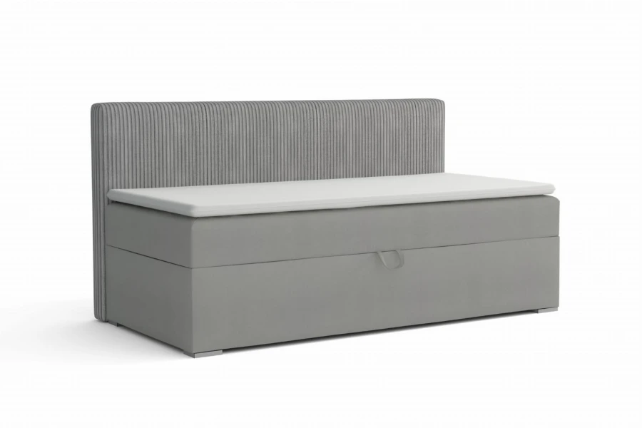 Modernes graues Boxspring-Einzelbett mit geripptem Kopfteil und weißem Topper.