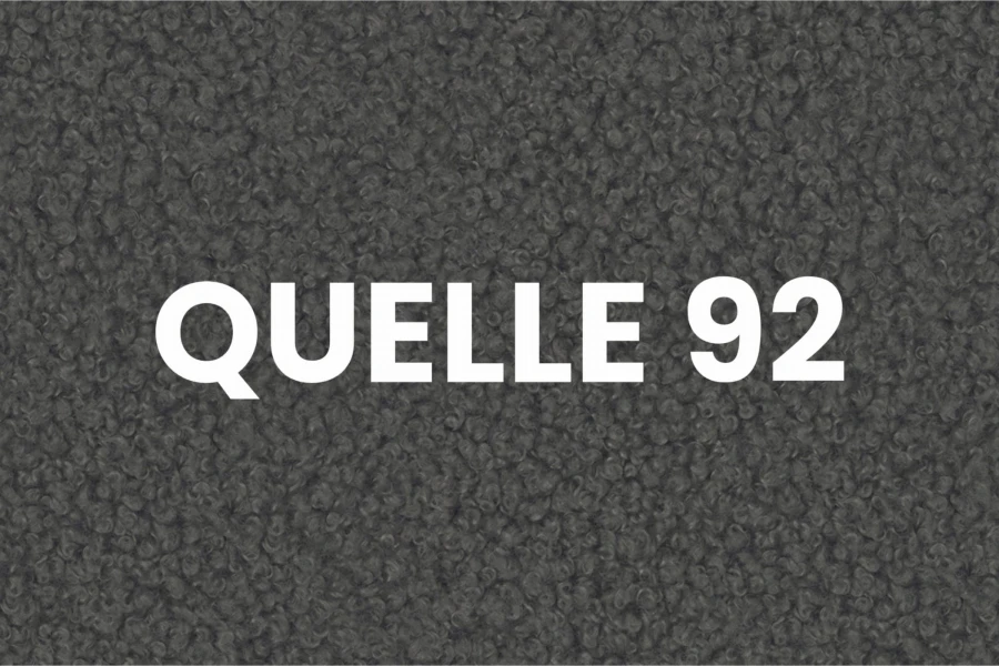 Detailansicht des hochwertigen Bouclé-Stoffs Quelle 92 in Dunkelgrau für Polstermöbel.