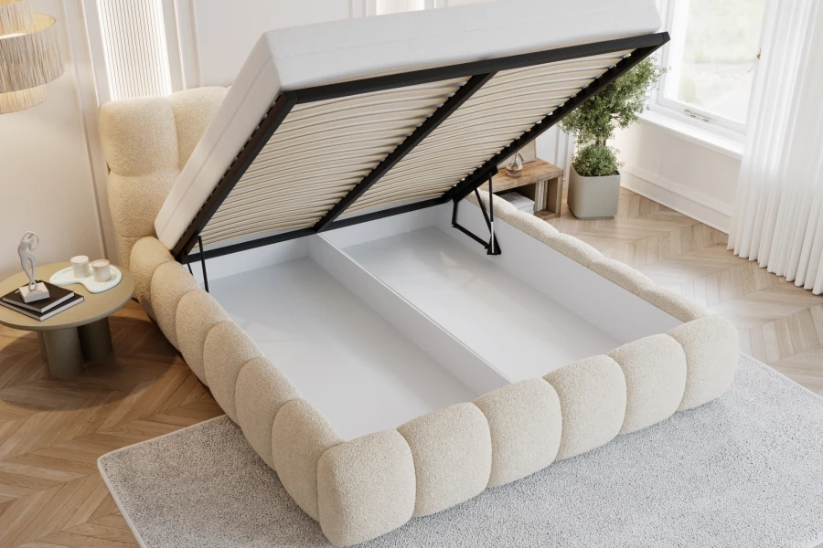 Beige bouclé-bed met royale bedbak voor praktische opbergruimte in de slaapkamer.