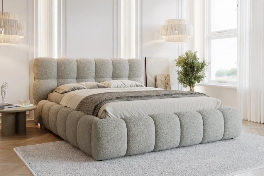 Lichtgrijs gestoffeerd bed in bubble-look voor een stijlvolle slaapkamer.
