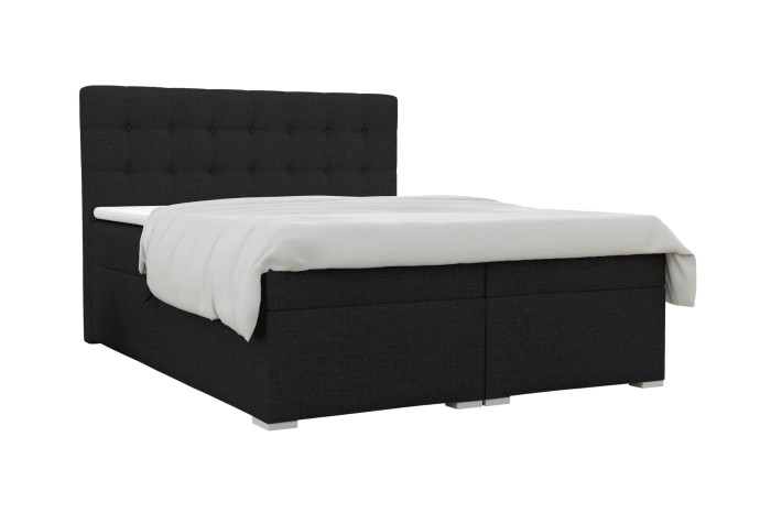 Boxspringbett Claudia in Dunkelgrau mit weißem Topper und gepolstertem Kopfteil vor weißem Hintergrund.