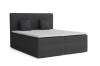 Anthrazitfarbenes Boxspringbett mit weißem Topper auf weißem Hintergrund.
