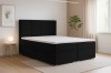 Schwarzes Boxspringbett Caro in einem modern eingerichteten Schlafzimmer.
