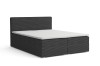 Dunkelgraues Boxspringbett mit Cord-Stoffbezug auf weißem Grund