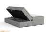 Boxspringbett mit praktischem Bettkasten und viel Stauraum, seitlich aufgeklappt.
