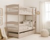 Beige bunk bed with practical drawers in a bright children's room.
