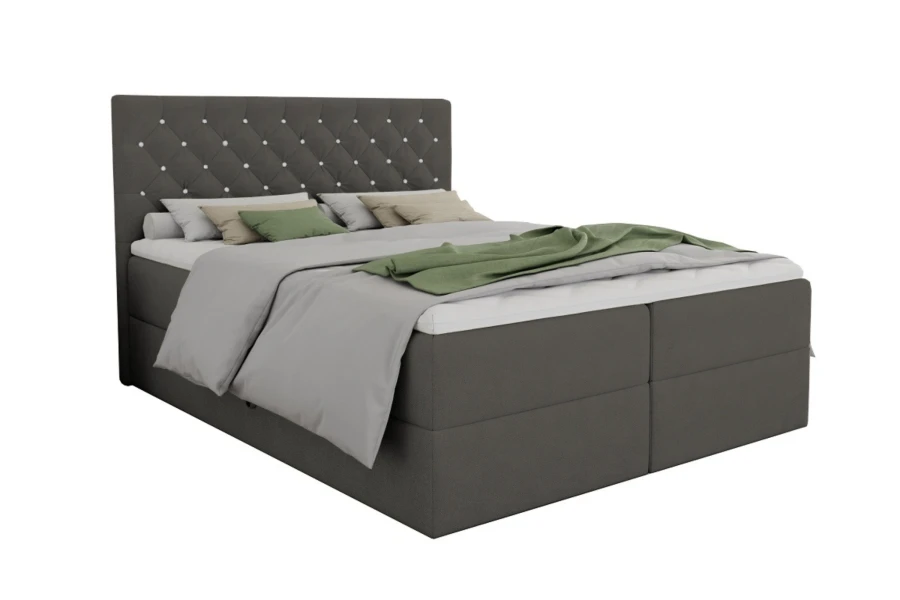 Elegantes graues Boxspringbett Arami mit gestepptem Kopfteil vor weißem Hintergrund.
