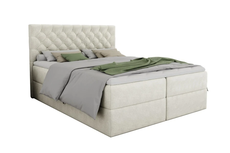 Beigefarbenes Boxspringbett mit elegantem Kopfteil und Kristallverzierung auf weißem Hintergrund.