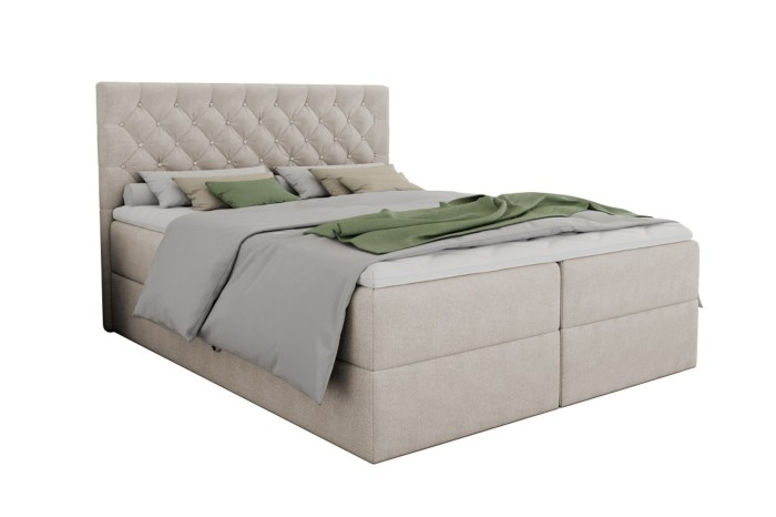 Elegantes Boxspringbett ARAMI in Beige mit hohem, gestepptem Kopfteil freigestellt.