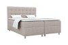 Modernes Boxspringbett in Beige mit elegantem Steppkopfteil.