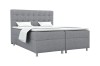 Modernes Boxspringbett in Grau mit gepolstertem Kopfteil und weißen Kissen vor weißem Hintergrund.