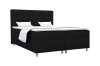 Modernes Boxspringbett in Schwarz mit weißem Topper und Kissen auf weißem Hintergrund.