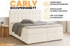 Beiges Carly Boxspringbett mit Bettkasten und Kaltschaum-Topper in modernem Schlafzimmer.