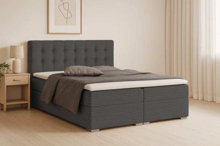 Modernes Boxspringbett Carly in Anthrazit mit strukturiertem Cord-Bezug und Polster-Kopfteil.