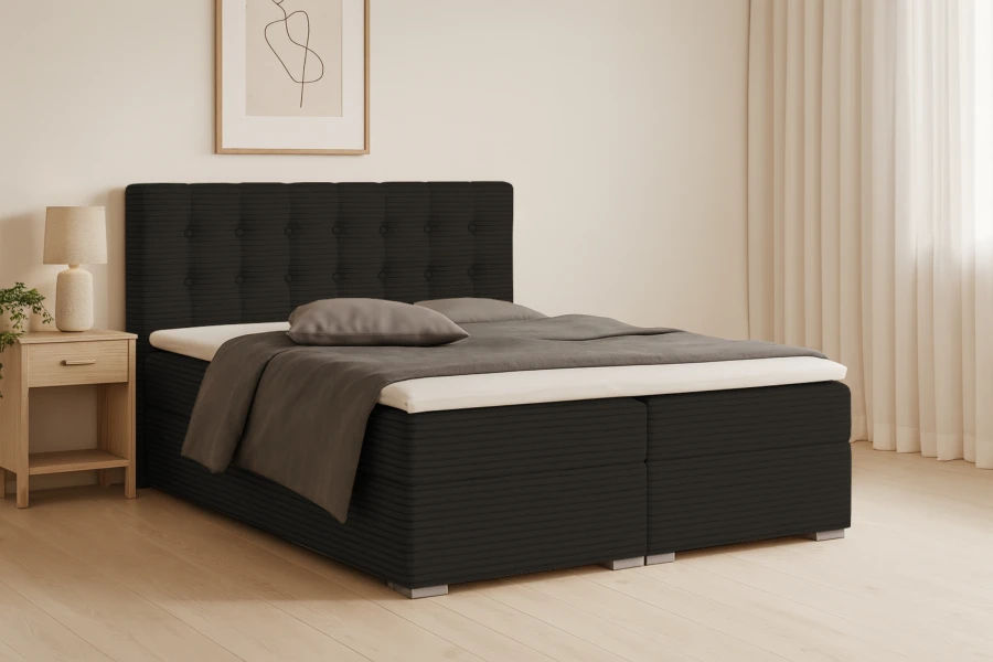 Donkergrijs boxspringbed Cynthia van corduroy stof met hoog hoofdbord en bedbak in een lichte kamer.