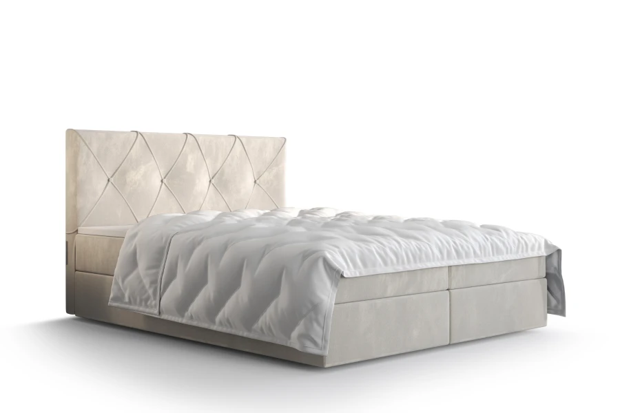 Beiges Boxspringbett mit gestepptem Kopfteil und weißer Bettwäsche auf weißem Hintergrund.